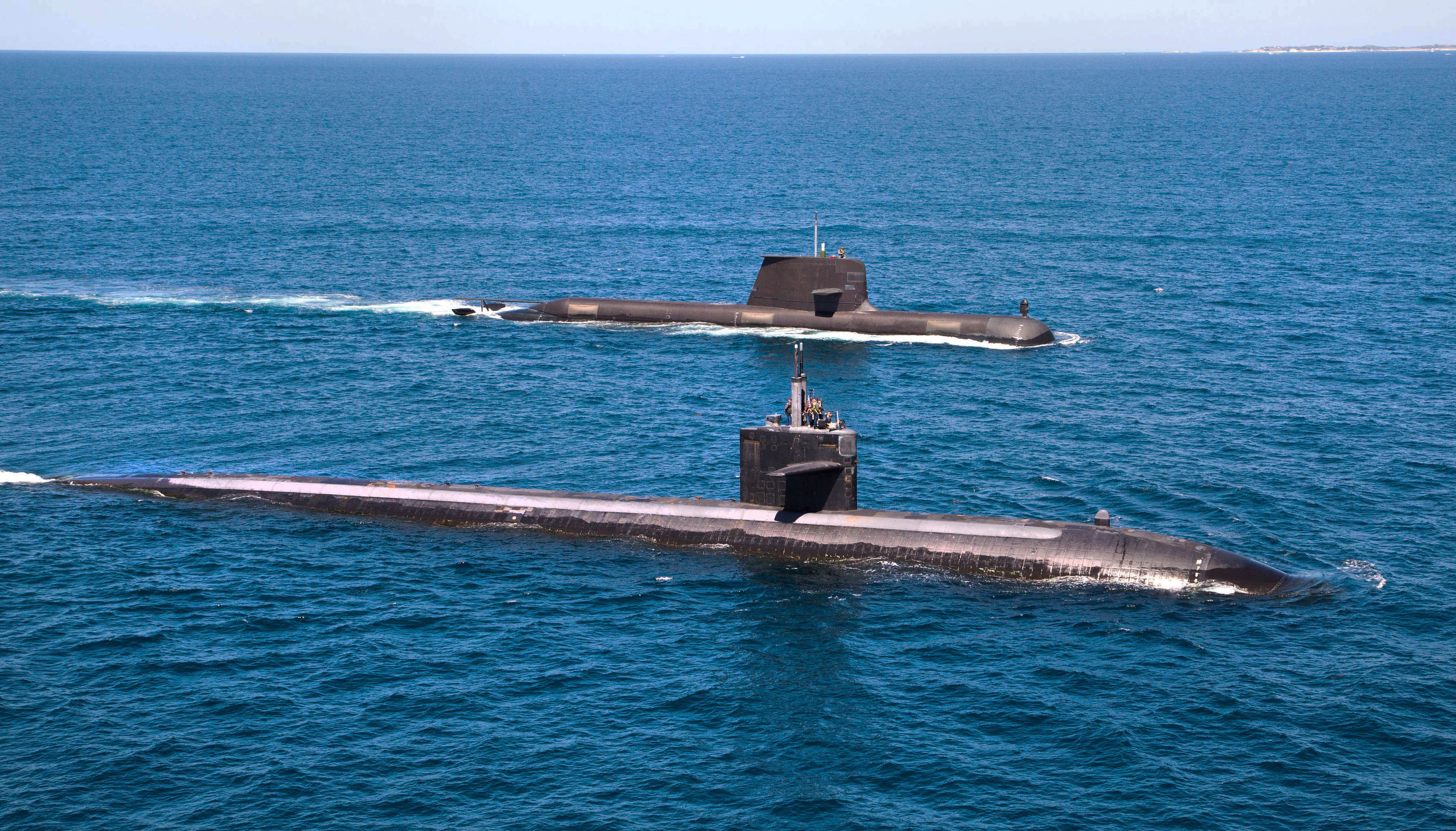 Los Angeles-class fast attack submarine USS Albuquerque (SSN-706) and Royal Australian Navy Collins-class submarine HMAS Rankin (SSG-78) operate together in waters off Rottnest Island, Western Australia on March 4, 2015.